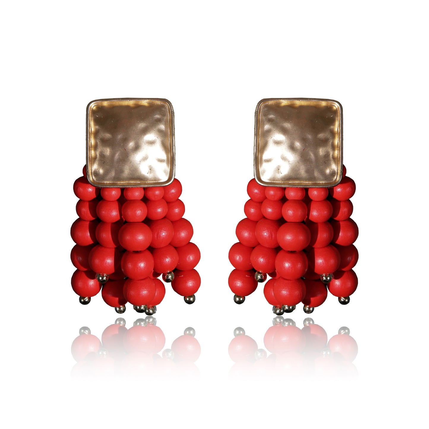 Beady Red and Gold Earrings feature hammered gold-plated square tops and clusters of shiny red beads—perfect summer jewelry to add a touch of luxury to any outfit. Displayed on white with a reflected shadow.