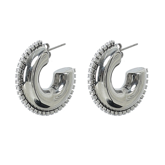 The Half Circle Silver Hoop features shiny silver crescent shapes outlined with sparkling zircon stones along the outer edge, all shown against a white background.