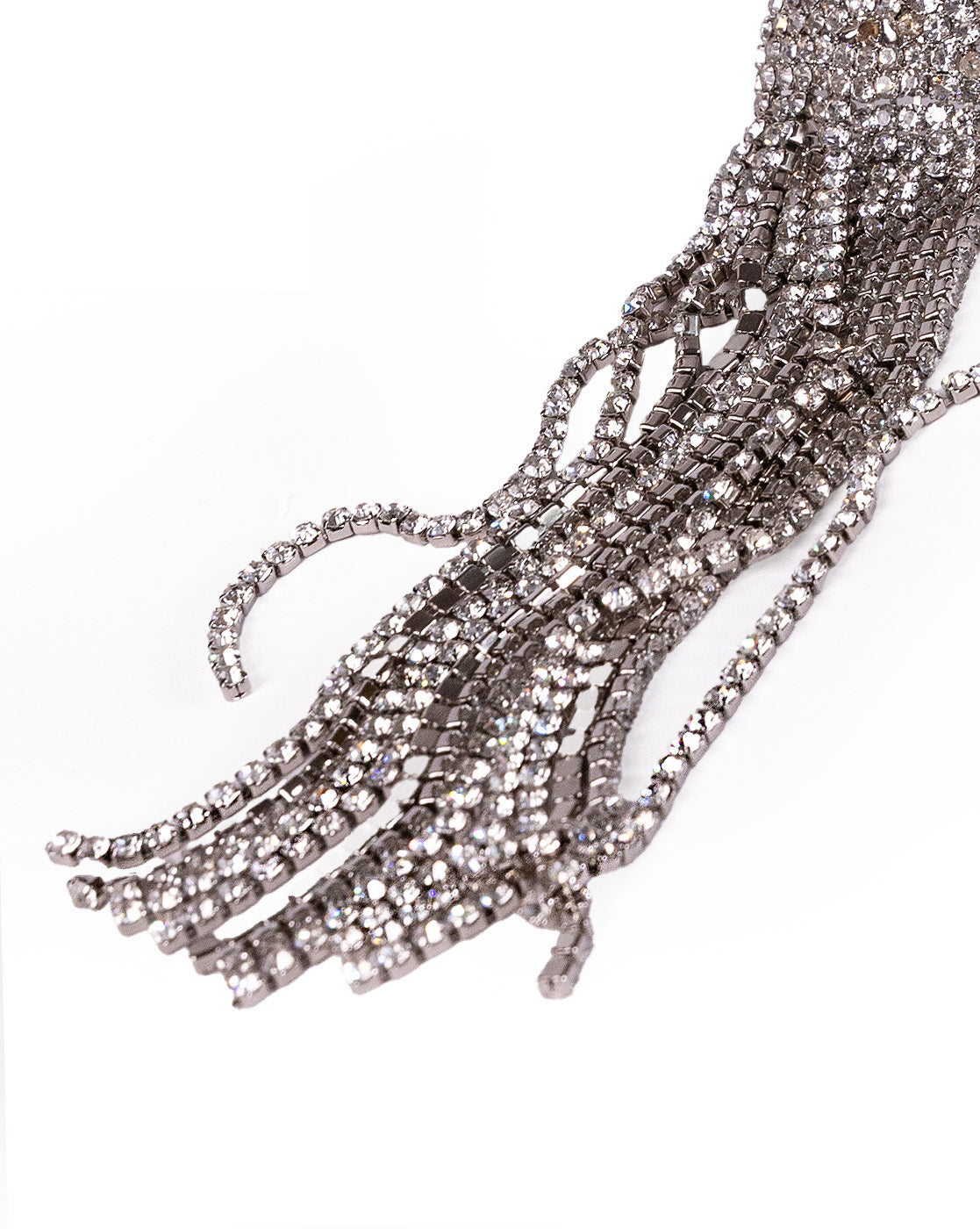 Close-up of Zircon Shimmer Tassel Earrings with several strands of silver rhinestone chains featuring lab-created stones, cascading and overlapping on a white background for a shimmering, draped effect.