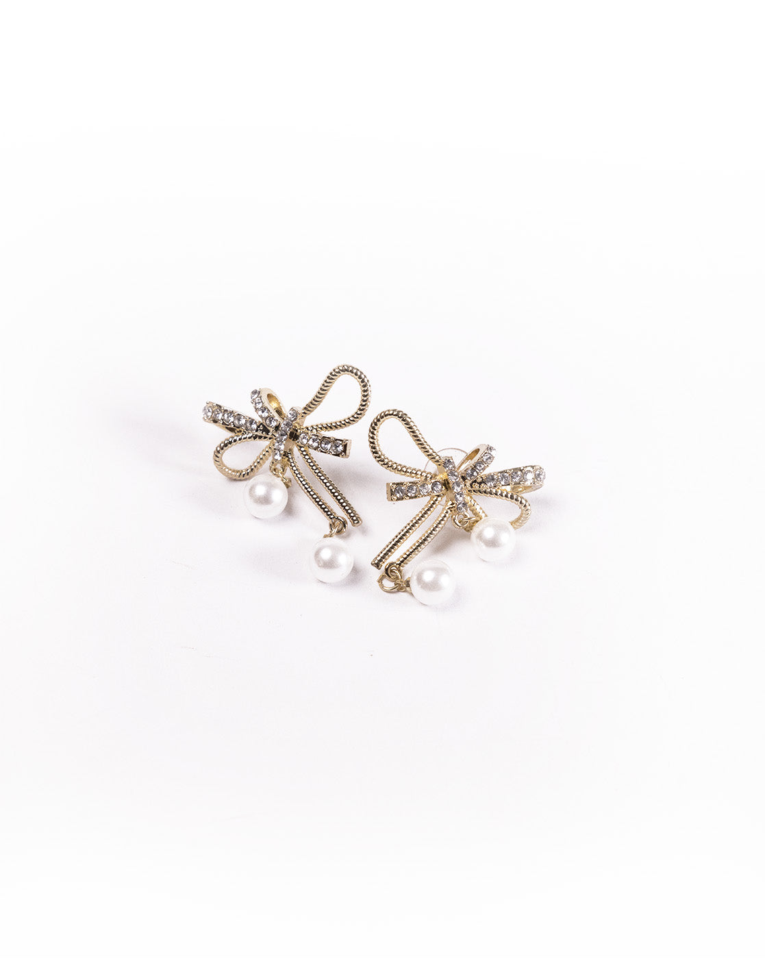 Bow & Pearl Earrings: 24K gold plated, bow-shaped design with sparkling clear gemstones and two dangling white pearls on each earring, shown against a white background.