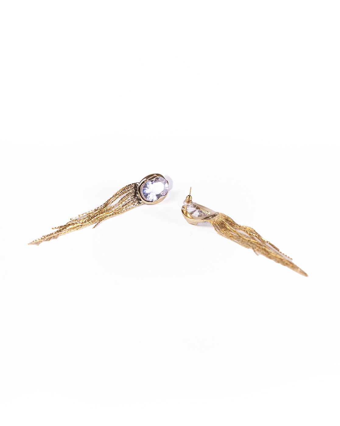 Tassels With Big Crystals earrings feature gold plating, oval clear gemstones at the top, and cascading gold chain fringe, shown on a white background.