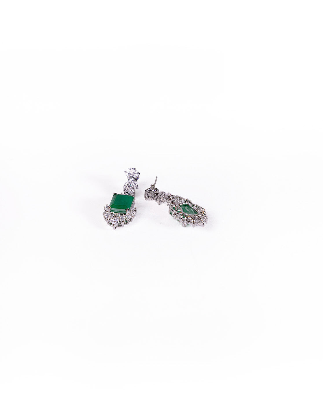 Queen’s Earrings Set: Silver Zirconia crystal earrings featuring green gemstones, clear stone embellishments, and intricate detailing, shown on a white background.