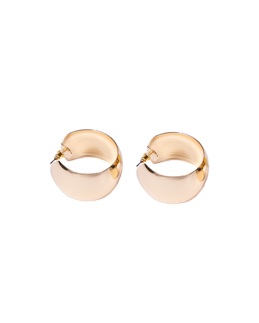 Thick gold hoop earrings, polished and 24K gold plated with a smooth, rounded design, deliver affordable luxury and are elegantly displayed on a white background.