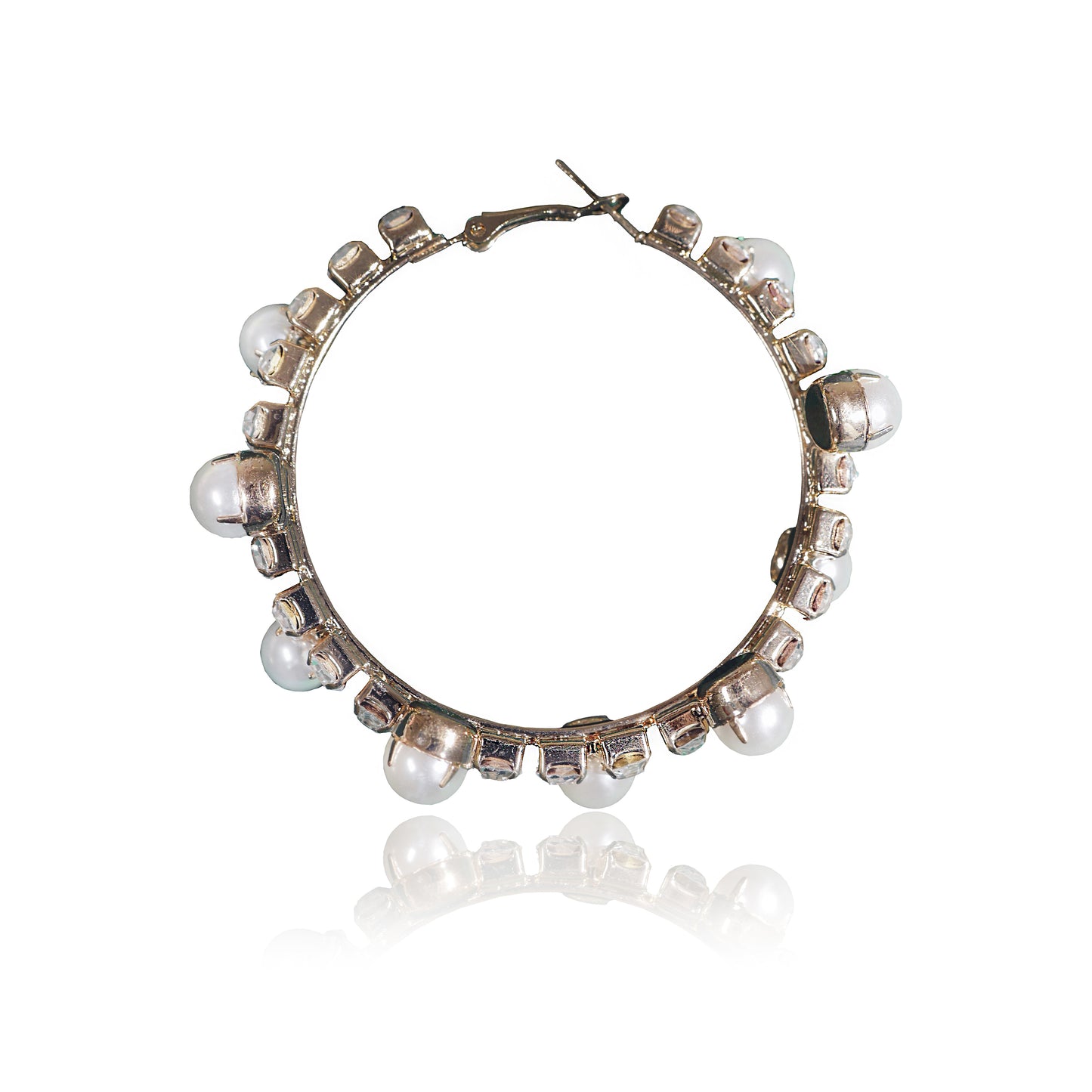 The Gold Pearl and Crystal Hoops are gold-plated hoop earrings featuring evenly spaced white pearls and small square crystal accents, displayed on a white background with a subtle reflection below.