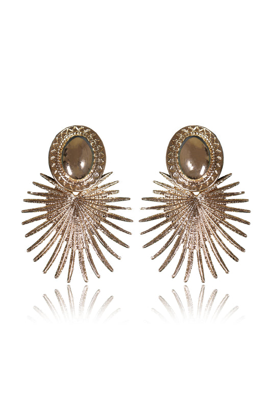 The Sun Rays Earrings feature an 18K gold-plated brass alloy with an oval stud and fan-shaped sunburst design, creating a reflective, eye-catching statement. Shown on a white background.